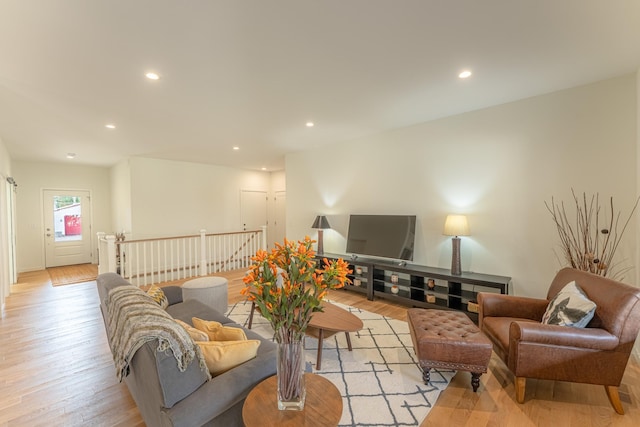 living room with light hardwood / wood-style floors