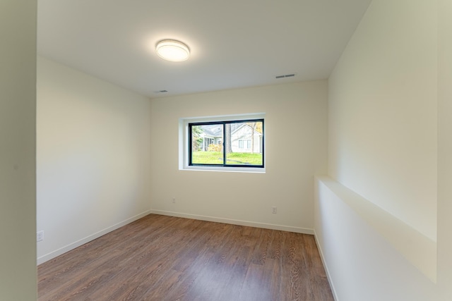 empty room featuring wood-type flooring