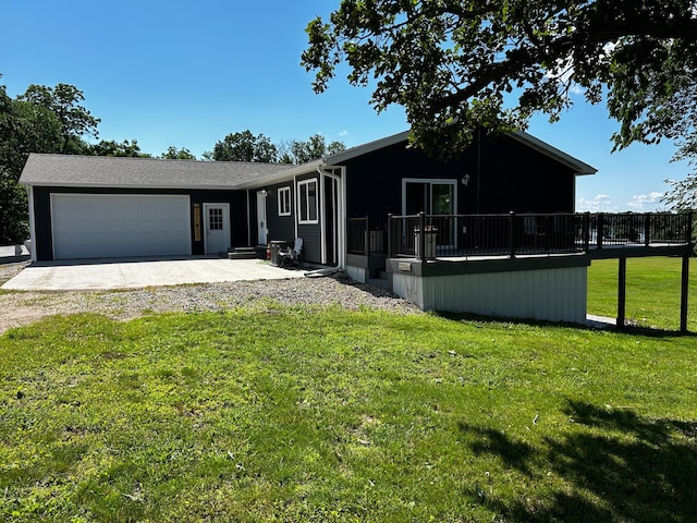 view of front of property with a garage and a front lawn