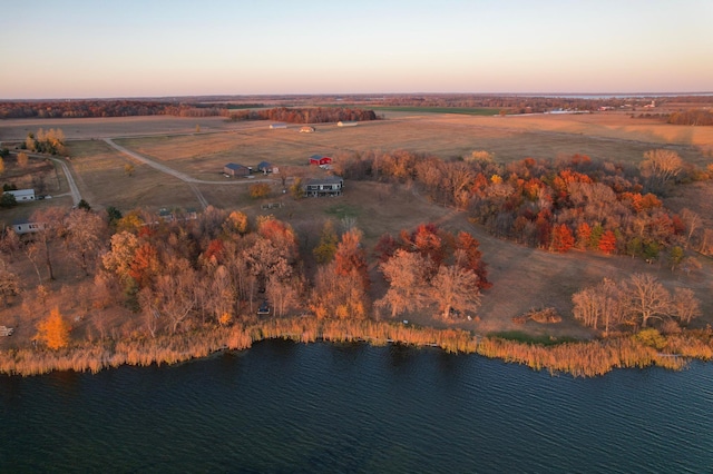 aerial view at dusk with a water view