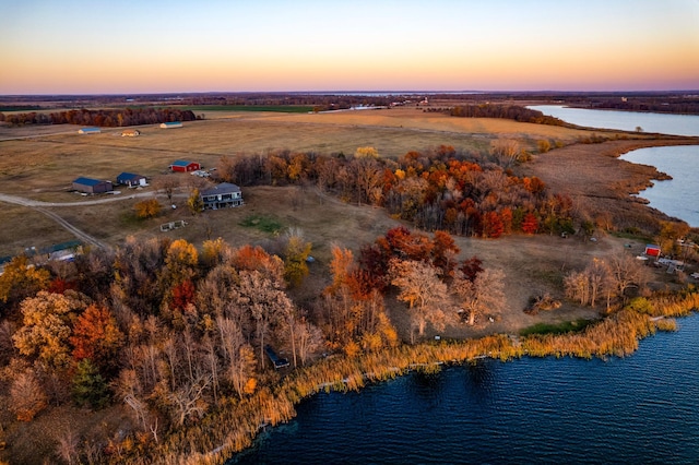 aerial view at dusk with a water view