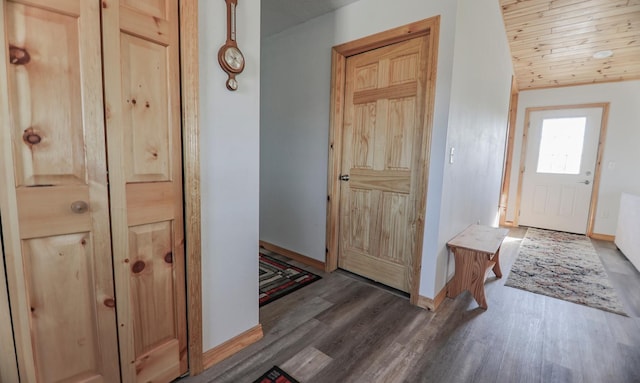 entrance foyer featuring wooden ceiling and dark hardwood / wood-style floors