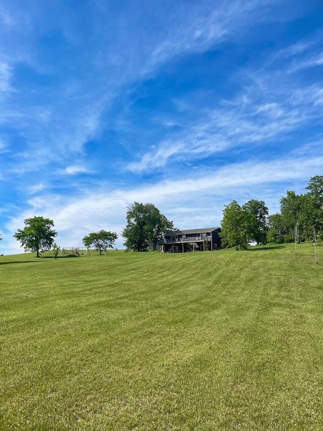 view of yard with a rural view