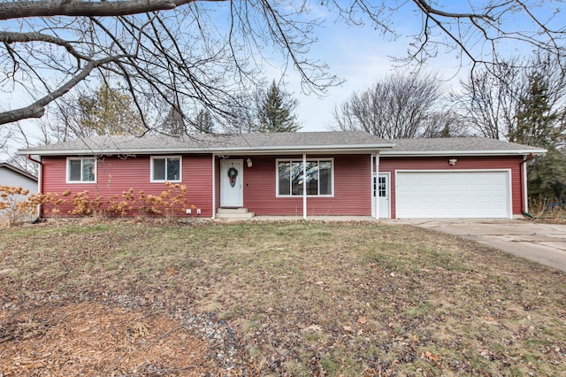 ranch-style home with a garage and a front yard