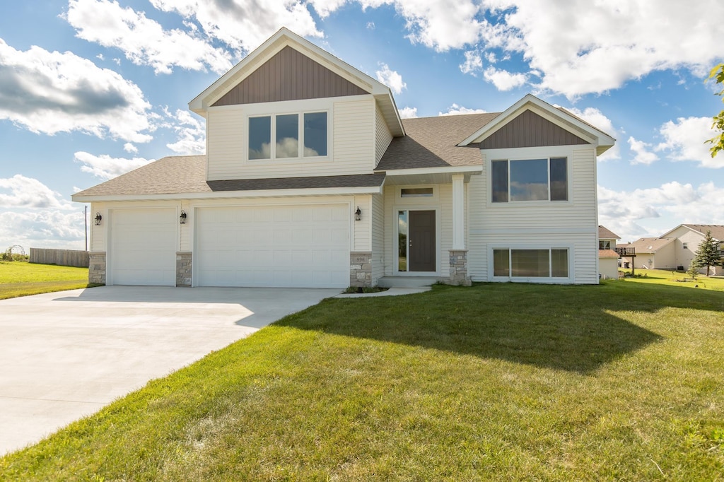 view of front of property with a garage and a front yard