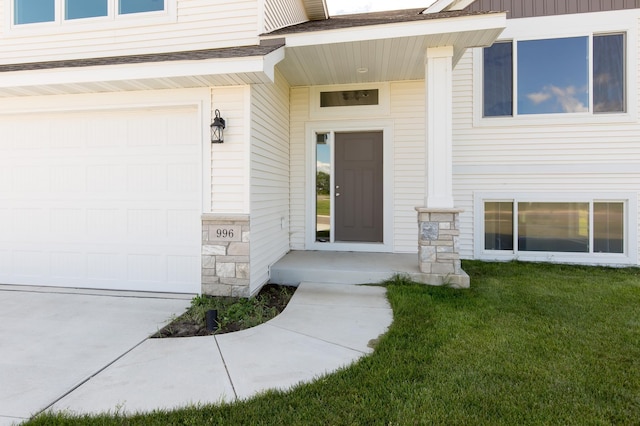 entrance to property with a yard