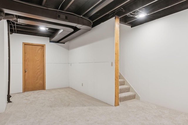 basement featuring carpet flooring