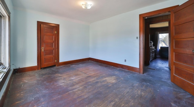 spare room featuring dark wood-type flooring