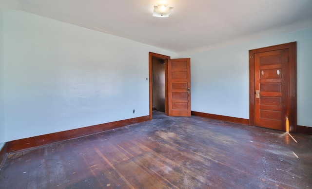 empty room with dark wood-type flooring