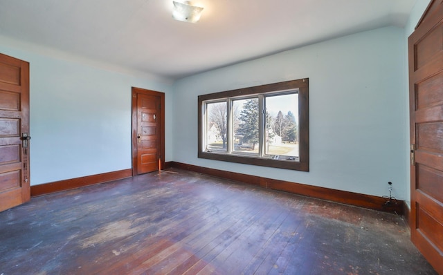 unfurnished bedroom featuring dark hardwood / wood-style flooring