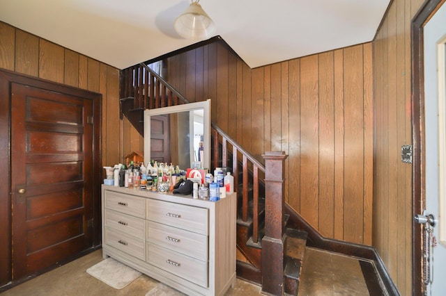 interior space featuring wooden walls