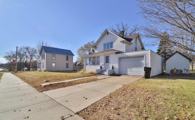 front facade with a front yard and a garage