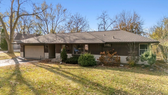 ranch-style home with a garage and a front yard