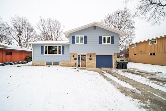 tri-level home featuring an attached garage