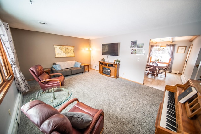 carpeted living area with visible vents and baseboards