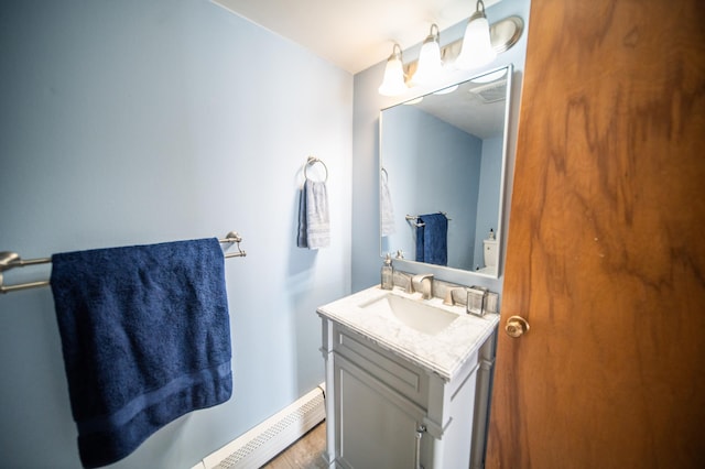 half bathroom with visible vents and vanity