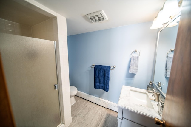 full bathroom with a baseboard radiator, visible vents, an enclosed shower, vanity, and wood finished floors