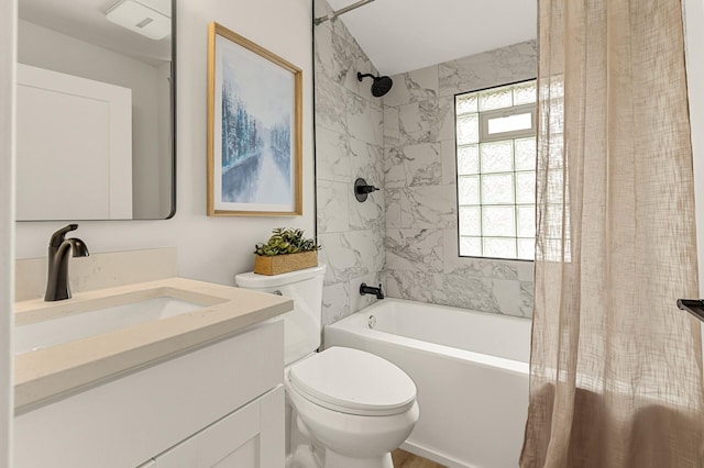 bathroom with vanity, toilet, and shower / tub combo with curtain