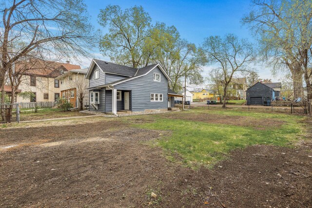 view of side of property featuring a residential view and fence