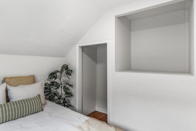 bedroom with vaulted ceiling