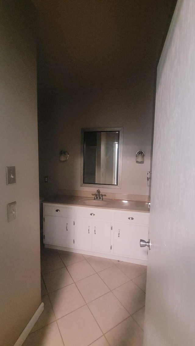 bathroom with vanity and tile patterned floors