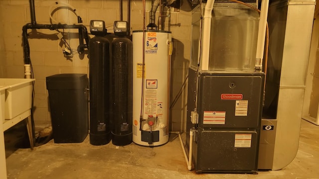 utility room featuring heating unit and water heater