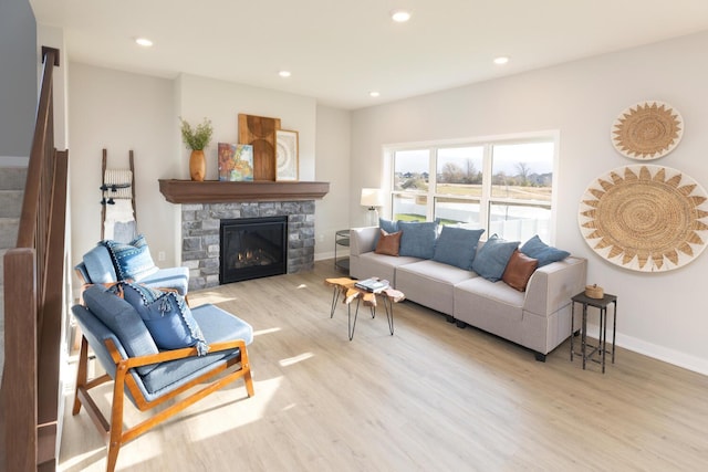 living room featuring a fireplace and light hardwood / wood-style floors