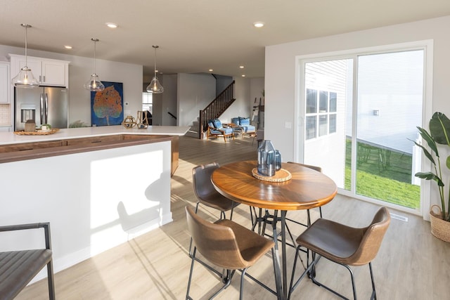 dining room with light wood-type flooring