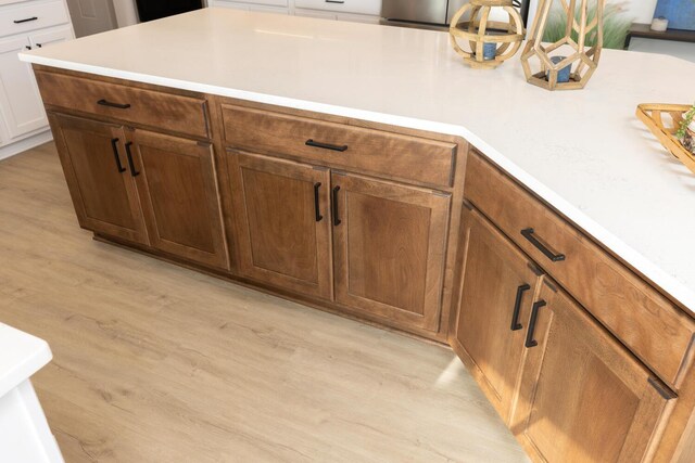 kitchen with light hardwood / wood-style flooring