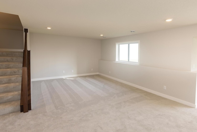 empty room with light colored carpet