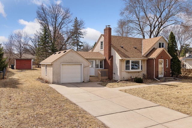 view of front of house with roof with shingles, driveway, an attached garage, a chimney, and brick siding