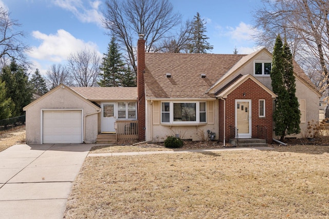 view of front of home with driveway, roof with shingles, an attached garage, a chimney, and brick siding