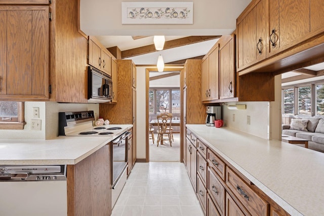 kitchen with light countertops, plenty of natural light, white dishwasher, and electric range oven