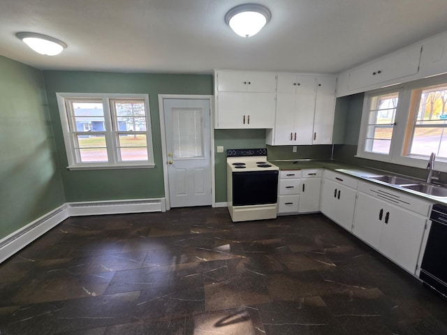 kitchen with white cabinets, plenty of natural light, and white range with electric cooktop