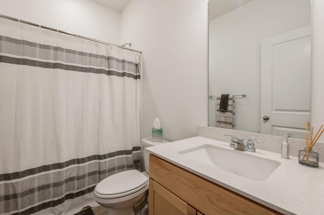 bathroom with vanity, toilet, and a shower with shower curtain