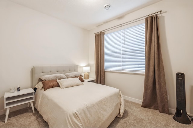 bedroom featuring light colored carpet