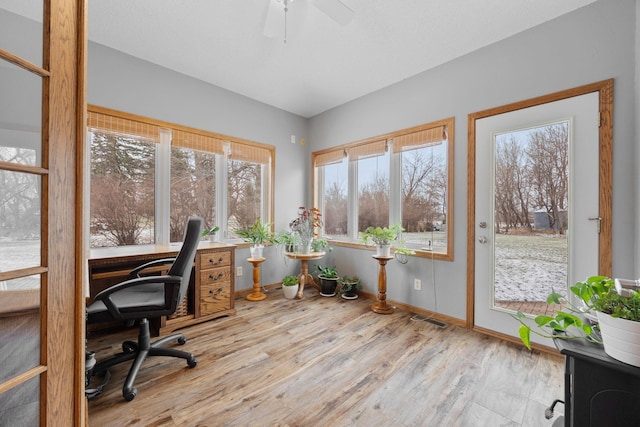 office area with ceiling fan and light hardwood / wood-style floors