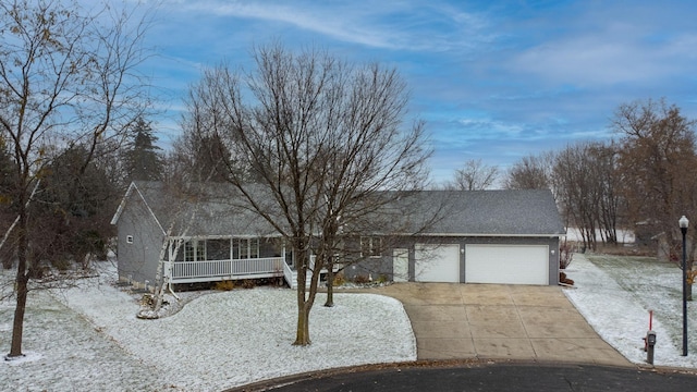 view of front of property featuring a sunroom and a garage