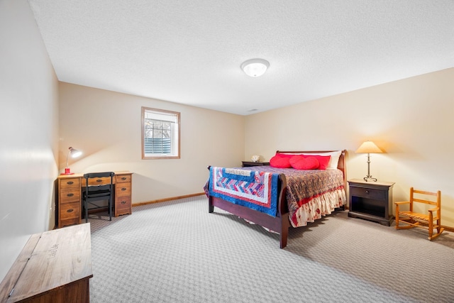 carpeted bedroom featuring a textured ceiling