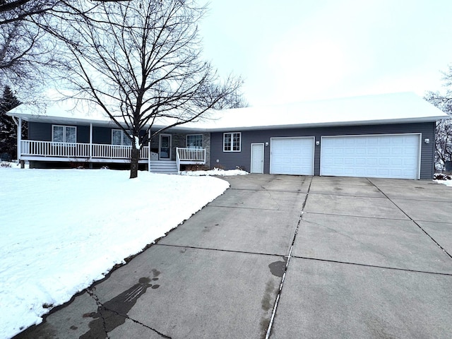 ranch-style house with covered porch and a garage