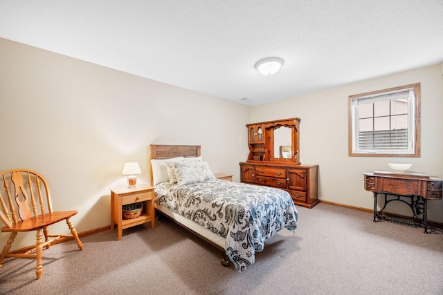 bedroom featuring baseboards, a textured ceiling, and carpet flooring