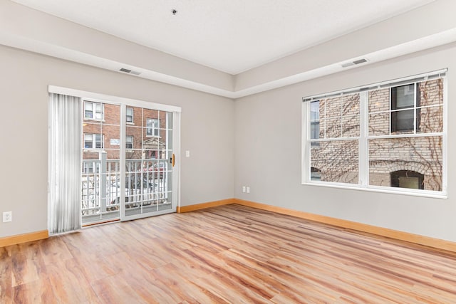 empty room with wood-type flooring