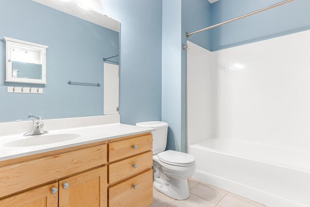 full bathroom with tile patterned flooring, vanity, toilet, and  shower combination