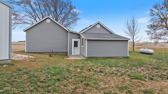 back of house with a yard