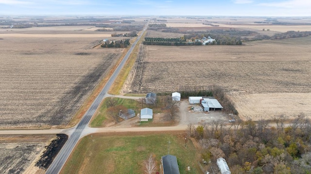 birds eye view of property with a rural view