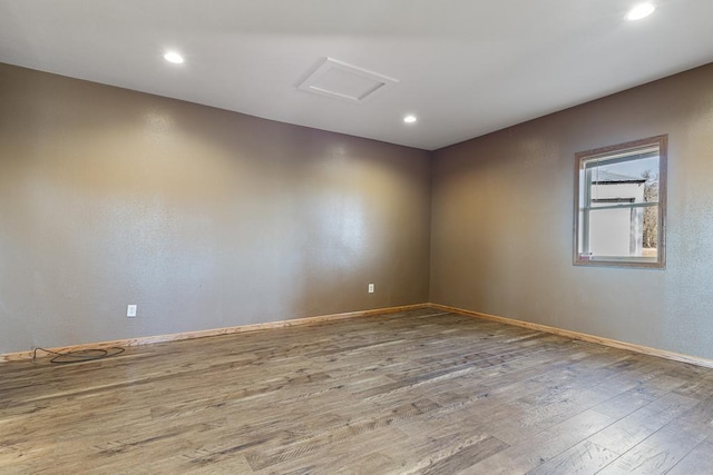 empty room featuring hardwood / wood-style flooring