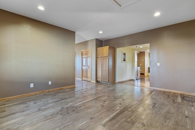 empty room with light hardwood / wood-style floors