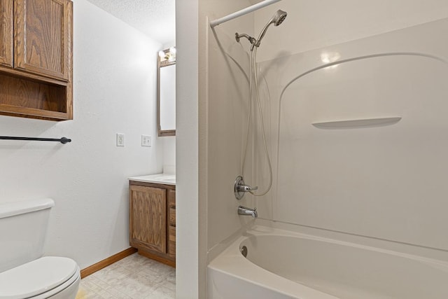 full bathroom with toilet, vanity, a textured ceiling, and shower / bathing tub combination