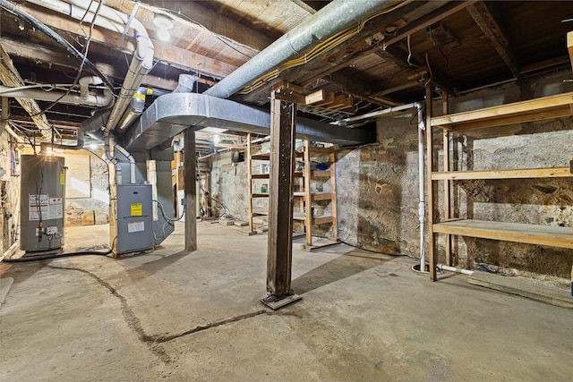 basement with water heater and heating unit