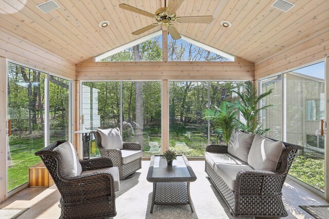 sunroom featuring vaulted ceiling, wood ceiling, and a ceiling fan